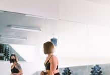 woman in black sports bra and black leggings doing exercise