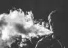 grayscale photography of smoking man