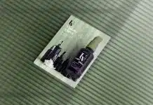 a magazine with a picture of a bottle of nail polish